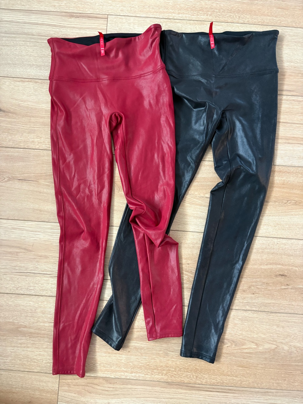 TWO pairs of SPANX Faux Leather Skinny Leggings in Red & Black